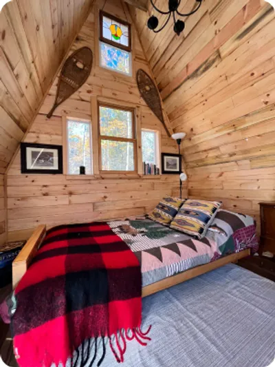 A bedroom from a cabin at Camp Blaze Retreat.