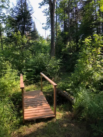 A path with a bridge at Camp Blaze Reteat.