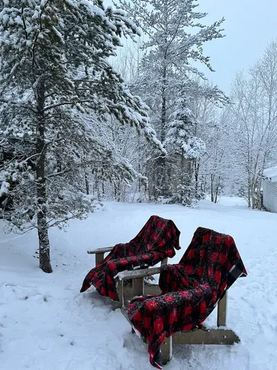 Two outdoor seats on a winter's day at Camp Blaze Reteat.